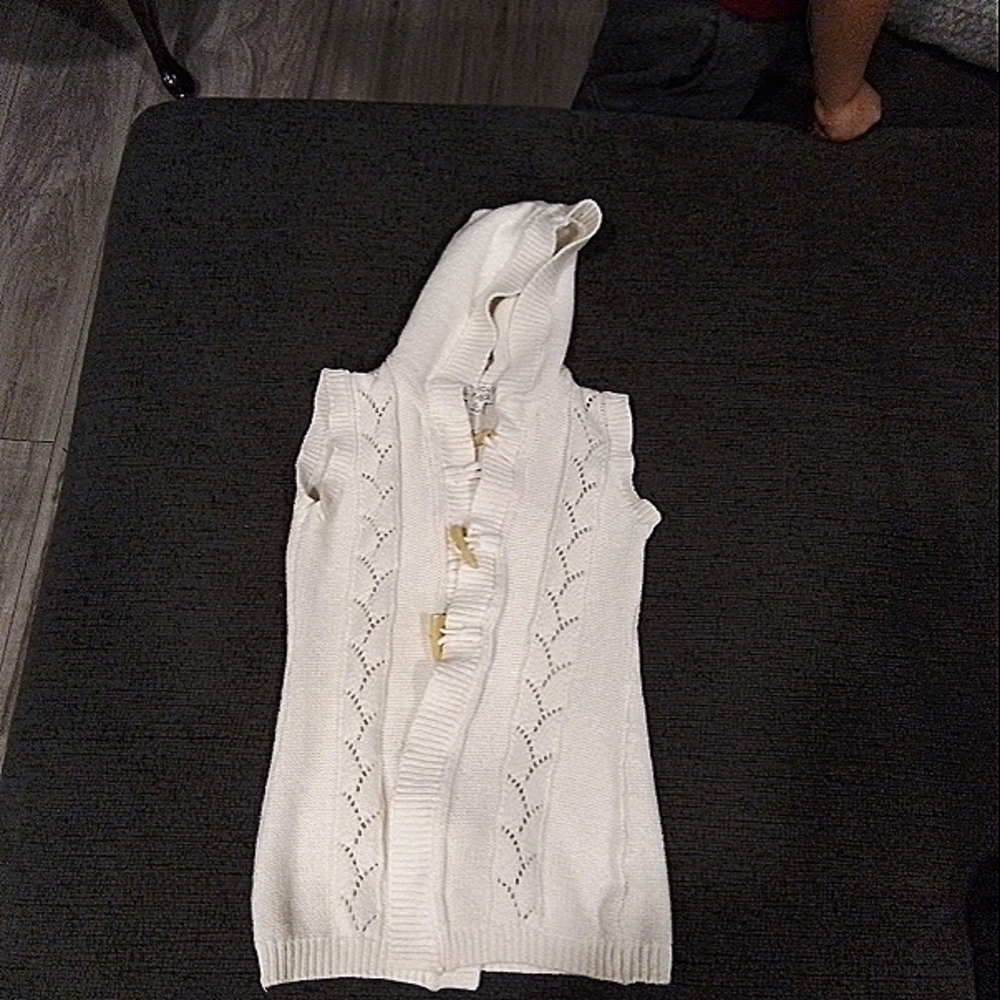 White Sleeveless Sweaters